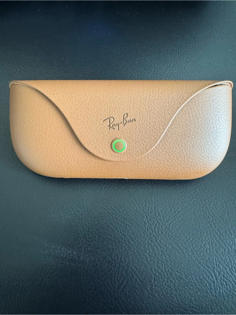 Meta Ray-Ban AI transitional Sunglasses with charging case.